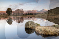 Kelly Hall Tarn and view of Coniston Old Man reflected, Lake District, Cumbria