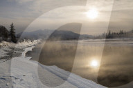 Reflected sun in Bow River in winter , Jasper, Canadian Rocky Mountains , Alberta, Canada