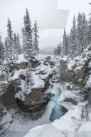 Partly frozen Athabasca Falls in mid-winter, Banff national park, Alberta, Canada