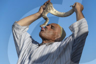 Snake charmer kissing snake, Djemaa el Fna, Marrakech, Morocco, North Africa, Africa