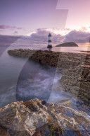 Sunrise over Penmon Point lighthouse, Anglesey, North Wales, United Kingdom
