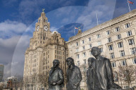 Bronze statue of the four Liverpool Beatles stands on Liverpool Waterfront, Liverpool, Merseyside