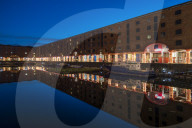 Reflected view at Christmas of The Albert Dock and Tate Museum, Liverpool, Merseyside