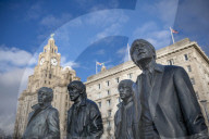 The bronze statue of the Beatles stands on Liverpool Waterfront, Liverpool, Merseyside