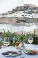 FIsh and salad served at a greek restaurant by the sea, Lindos, Rhodes, Greece
