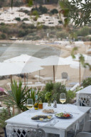 FIsh and salad served at a greek restaurant by the sea, Lindos, Rhodes, Greece