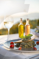 Spanikopita with white wine at sunset at a restaurant in Pefkos, Rhodes, Greece