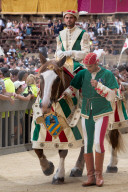 At the pageant that precedes the Palio race, representatives and riders of each neighbourhood parade in traditional costume.