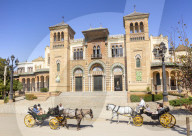 Tourists on a sightseeing carriage ride outside the Museum of Popular Arts and Traditions Seville Spain Andalusia Spain Europe