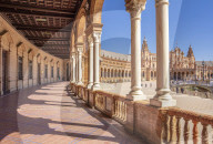 Under the arches of the semicircular Plaza de EspaÃ±a Maria Luisa Park Seville Andalusia Spain EU Europe
