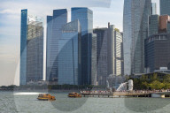 Tourist boats with the Merlion statue and Marina Bay skyline