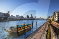People walking along Sumida River, Tokyo, Japan