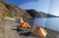 People camping next to Lake Motosu, Yamanashi Prefecture, Japan