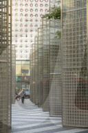 Man walking past modern architecture, Gangnam, Seoul, South Korea