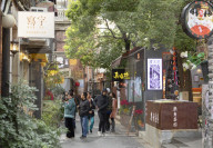 People walking around alleyways of Tianzifang, Shanghai, China