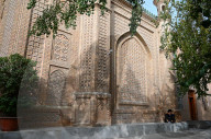 Man outside ornate mosque in city centre, Hotan, Xinjiang, China