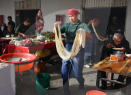 Noodle maker in Kashgar Sunday Market, main Silk Road trading centre, Xinjiang, China