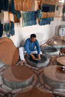 Demonstration of centuries old traditional Ajrakh indigo dying of skeins of locally spun cotton, Ajrakhpur, Bhuj, Gujarat, India