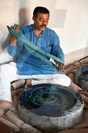Demonstration of centuries old traditional Ajrakh indigo dying of skeins of locally spun cotton, Ajrakhpur, Bhuj, Gujarat, India