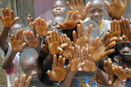 African village. Group of children showing their hands. Datcha-Attikpaye. Togo.