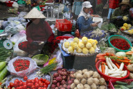 Woman selling fresh vegatables at market. Quy Nhon. Vietnam.