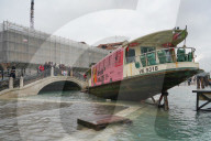 Stranded public boat during the high tide in Venice, november 2019, Venice, Italy, Europe