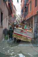 Stranded taxi boat during the high tide in Venice, november 2019, Venice, Italy, Europe