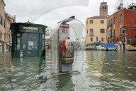 High tide in Venice, november 2019, newsstand and telephone booth at Ponte delle Guglie, Venice, Italy, Europe