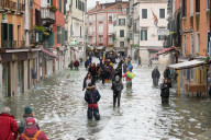 High tide in Venice, november 2019, people walking in Rio TerÃ  San Leonardo, Venice, Italy, Europe