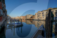 Reflections of the buildings in the calm water of the Grand Canal during Coronavirus lockdown, Venice, Italy, Europe