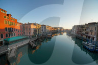 Reflections of the buildings in the calm water of the Grand Canal during Coronavirus lockdown, Venice, Italy, Europe