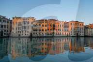 Reflections of the buildings in the calm water of the Grand Canal during Coronavirus lockdown, Venice, Italy, Europe
