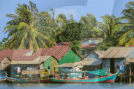 Fishing boats moored on the Praek Tuek Chhu River in this old French colonial river port, Kampot, Kampot Province, Cambodia
