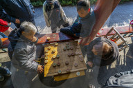 Locals playing board game in Gathering at the Ghost Corridor in the Temple of Heaven, Beijing, People's Republic of China, Asia