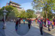 Locals performing Tai chi near City wall of Xi'an, Shaanxi Province, People's Republic of China, Asia