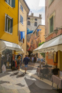 View of cafes and visitors on narrow street on a sunny day, Garda, Lake Garda, Province of Verona, Italy, Europe