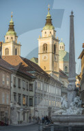 Obelisk and Fountain of the Carnia rivers and St Nikolaus Church, Old Town, Ljubljana, Slovenia