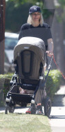 Jessica Hart is seen taking her 6-month-old daughter Baby-Rae and her dog out for a walk in her Los Angeles neighborhood.
