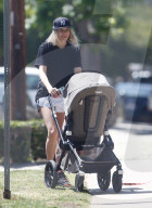 Jessica Hart is seen taking her 6-month-old daughter Baby-Rae and her dog out for a walk in her Los Angeles neighborhood.