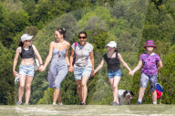 Members of the public enjoy a walk on Box Hill, Surrey as the warm weather continues.