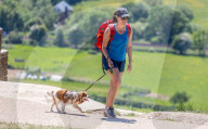 Members of the public enjoy a walk on Box Hill, Surrey as the warm weather continues.