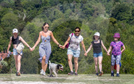 Members of the public enjoy a walk on Box Hill, Surrey as the warm weather continues.