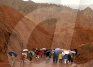 FEATURE -  Touristen in den Rainbow Mountains in Wangye, China