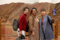 FEATURE -  Touristen in den Rainbow Mountains in Wangye, China