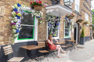 Tennis decorations start to go up in Wimbledon Village, SW19 today.