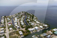 ‘The water is coming’: Florida Keys faces stark reality as seas rise. Officials prepare to elevate streets despite financial shortfalls, amid recognition that not every home can be saved.