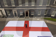 Prime Minster Boris Johnson poses with St George's Flag