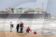 Public brave high winds and rain on the South Coast today. 