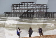 Public brave high winds and rain on the South Coast today. 