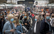 NEWS - Coronavirus: Vor der Lockerung - Pendler mit Masken in London